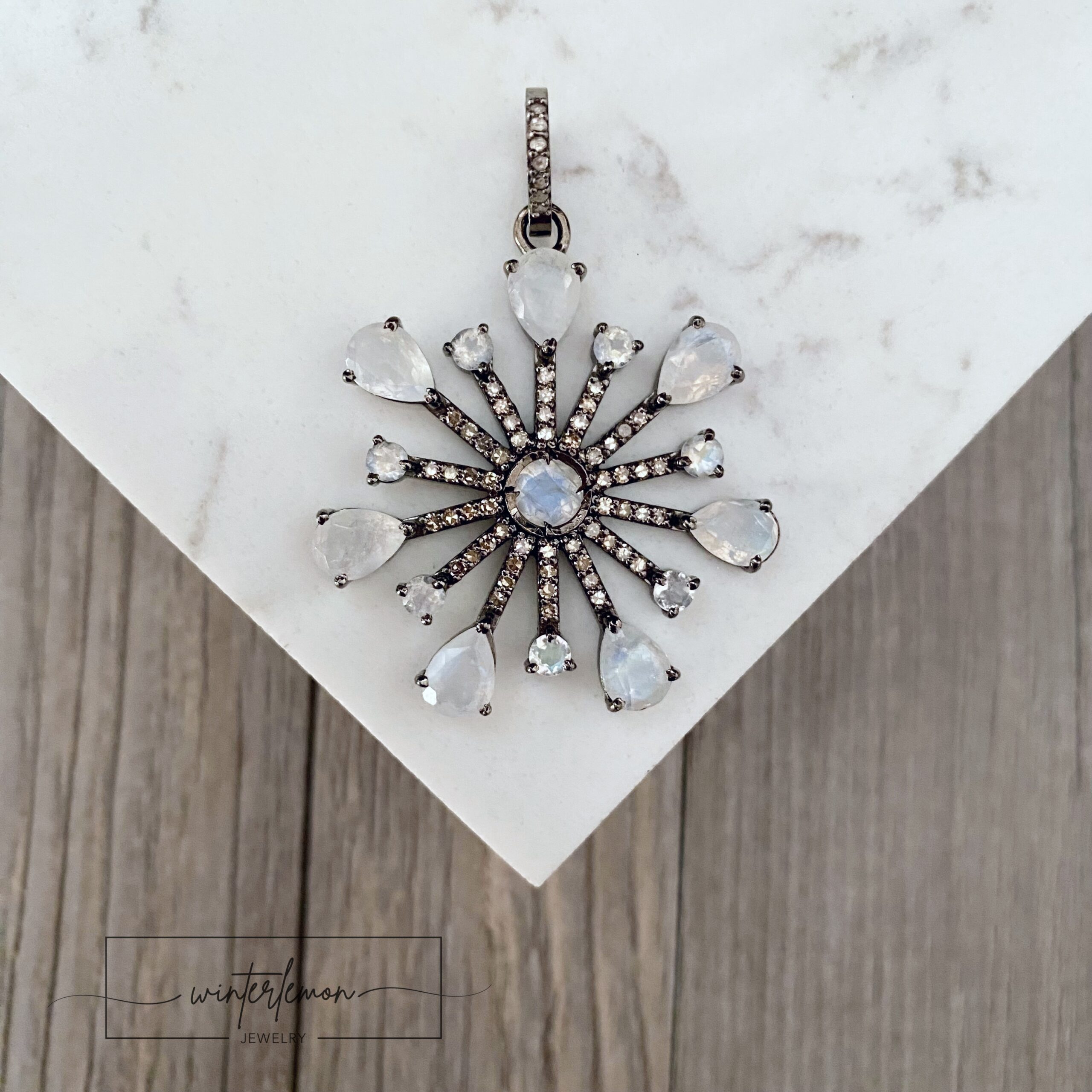 Sterling silver snowflake charm with moonstone